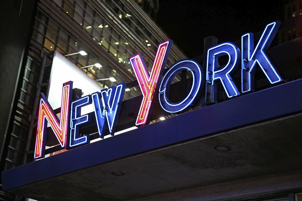 "Illuminated New York sign in Times Square at night, New York City, NY, USA."