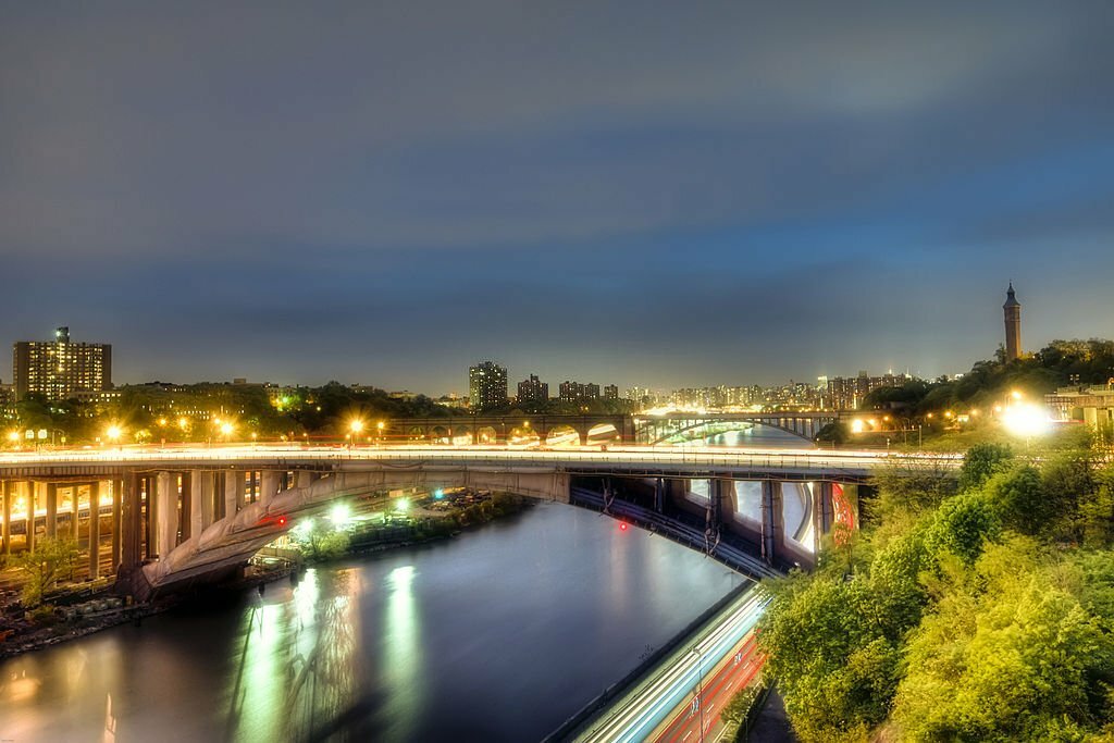 The view of the Harlem River with the Bronx on the left, Manhattan on the right, and the New York City (NYC) skyline in the background.